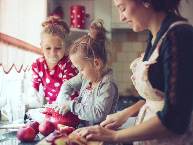 Mother with kids at the kitchen